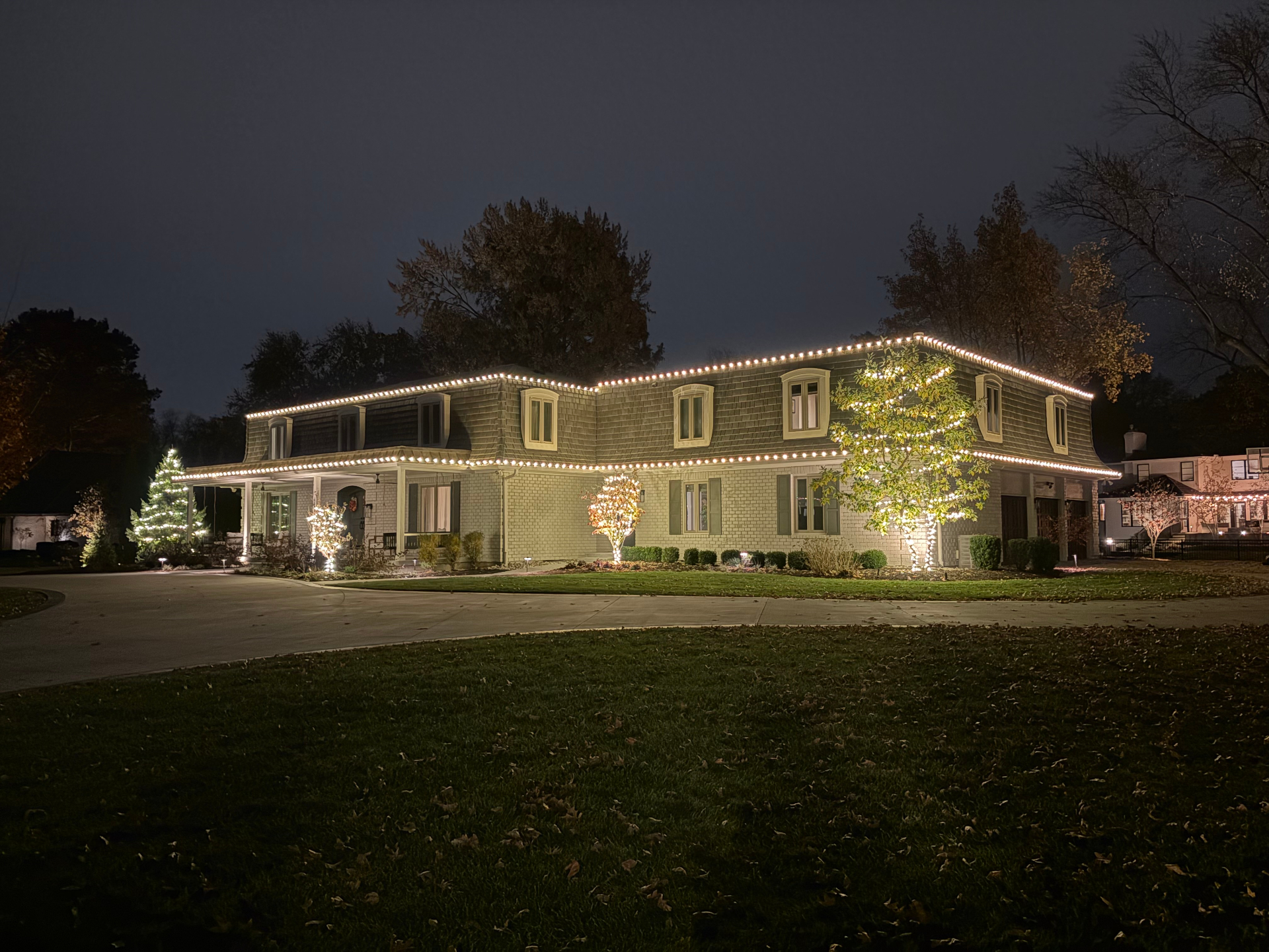 Professional holiday Christmas lighting installation on a Kansas City home